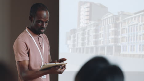 Black-Man-Presenting-Architectural-Project-on-Business-Conference